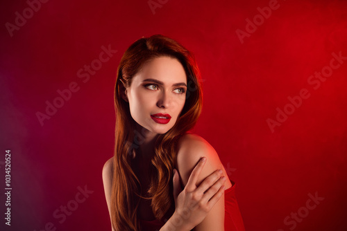Photo of lovely attractive lady look empty space hug self dressed sexy leather garment isolated on red color background