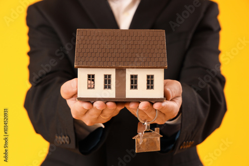 Male real estate agent with...