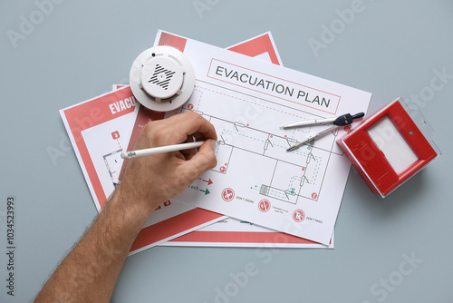 Man with smoke detector dra...