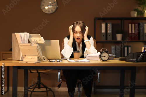 Stressed businesswoman tryi...