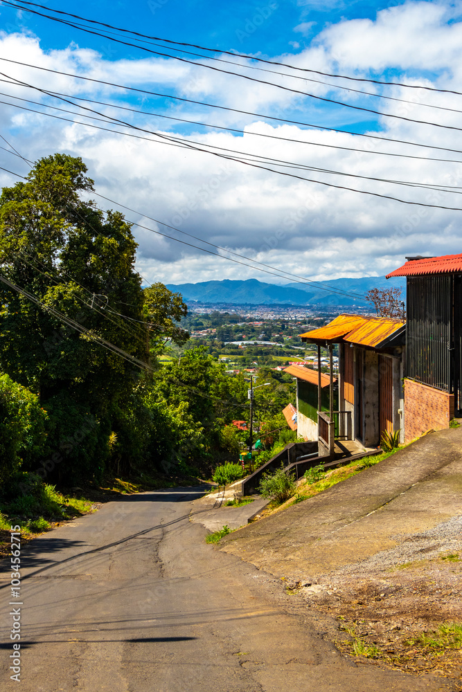 Village road street through land forest town mountains Costa Rica. Village road street through land forest town mountains Costa Rica.