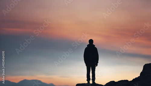 Silhouette of man with backpack on rocky mountain peak, watching sunset, back view.






 photo