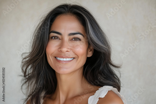 Beautiful middle age natural woman with perfect skin on neutral background with space for text, skincare concept