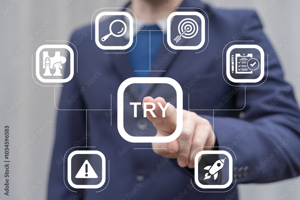 Man working on virtual touch screen presses word: TRY. Try it now or try again business slogan concept. Try it free.