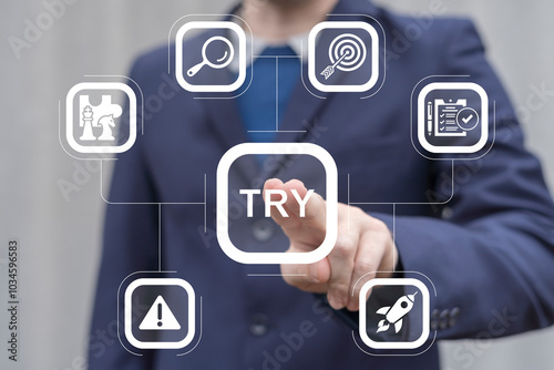 Obraz na płótnie Man working on virtual touch screen presses word: TRY. Try it now or try again business slogan concept. Try it free. w salonie