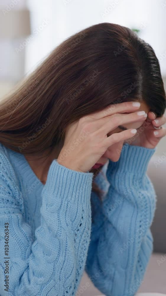 Woman, tired and depression in home with regret, mistake and self doubt on sofa. Mature person, stress and frustrated in living room with mental health awareness, trauma memories and tension headache Woman, tired and depression in home with regret, mistake and self doubt on sofa. Mature person, stress and frustrated in living room with mental health awareness, trauma memories and tension headache
