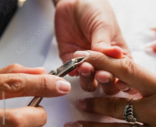 Close-Up of Nail Technician Trimming Cuticles During Manicure