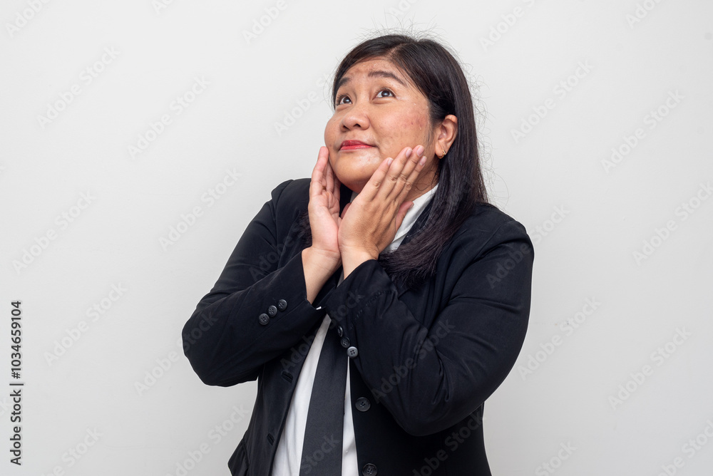 The woman displays a surprised or delighted expression, with both hands resting on her cheeks. Her wide-eyed look and subtle smile give a playful and cheerful tone. The woman displays a surprised or delighted expression, with both hands resting on her cheeks. Her wide-eyed look and subtle smile give a playful and cheerful tone.