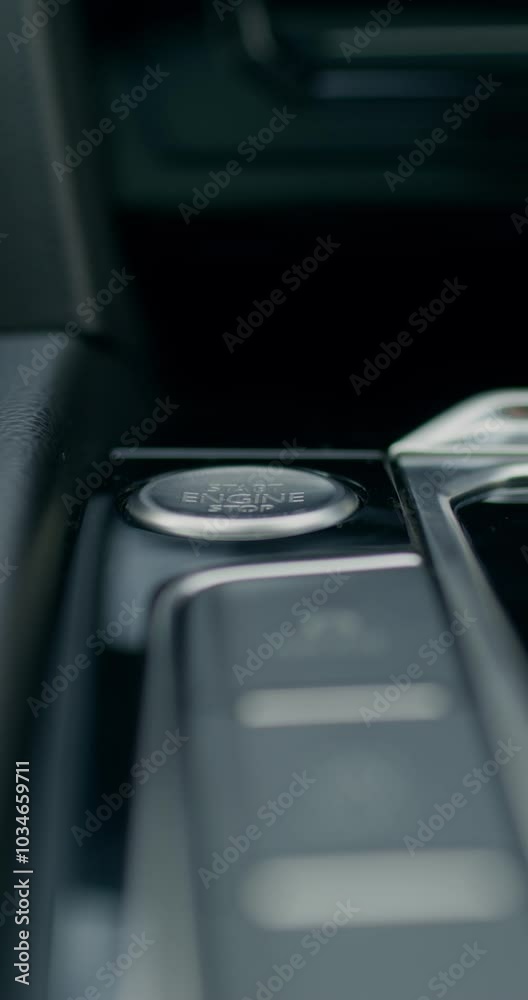 The man presses the keyless start button of the car. Close-up of his hands, an unrecognizable person. View from the car interior. The man presses the keyless start button of the car. Close-up of his hands, an unrecognizable person. View from the car interior.