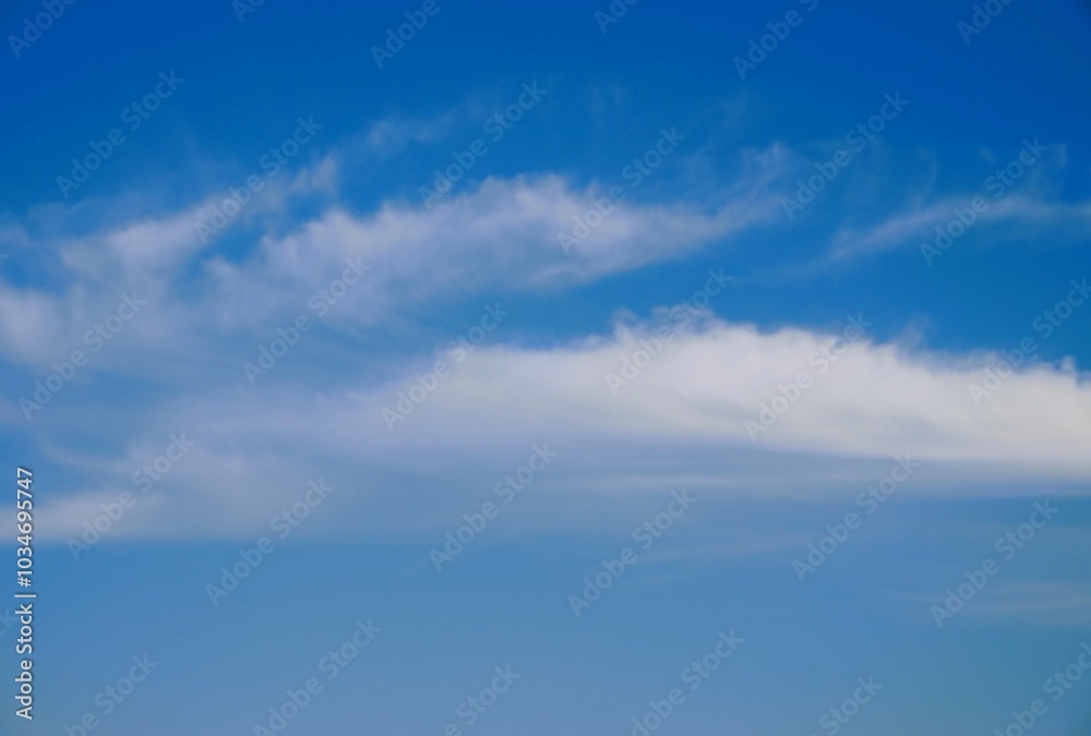Obraz premium photo of a clear blue sky and white clouds, looks beautiful
