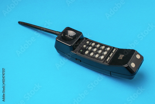 Vintage Retro Mobile Brick Phone on Vibrant Blue Background Iconic 80s Communication Technology