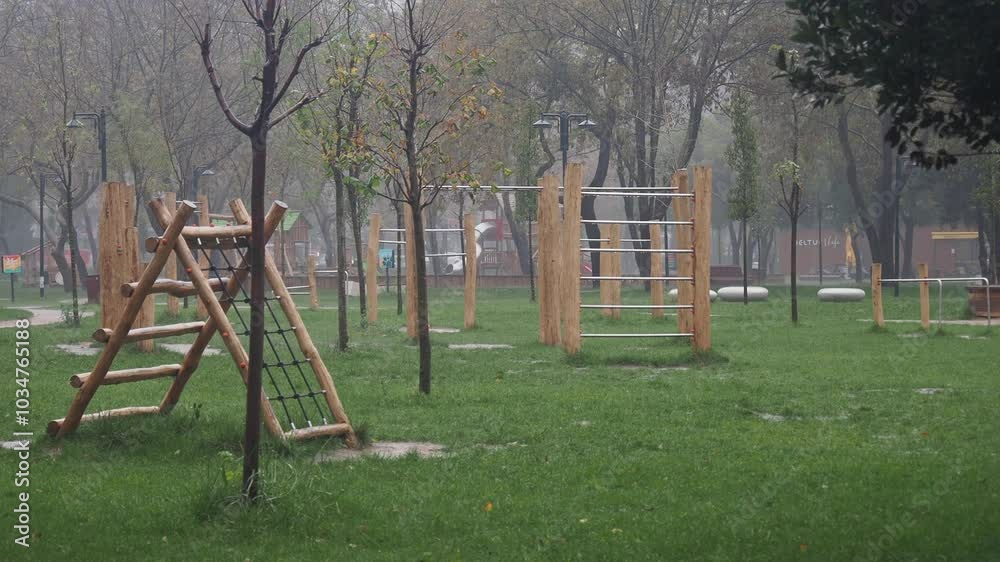 A Quiet Playground Set in a Misty Park, Ideal for Calm and Active Community Enjoyment A Quiet Playground Set in a Misty Park, Ideal for Calm and Active Community Enjoyment