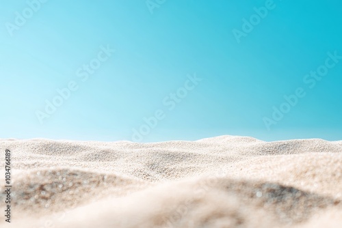 A close-up view of white sand dunes against a bright blue sky. photo