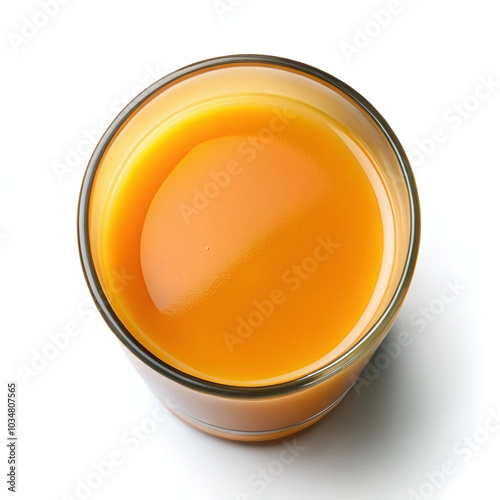 A refreshing glass of orange juice on a white background top view.