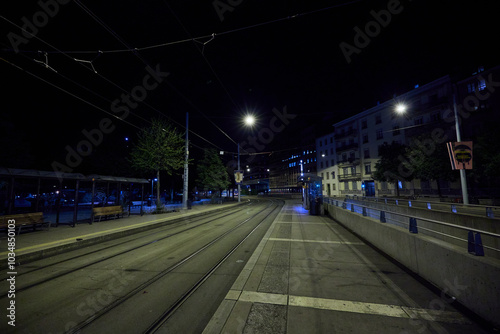 Tram Stop at Night in Geneva, Switzerland with Empty Streets photo