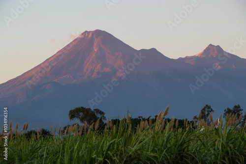 Volcan y nevado de Colima al aterdecer photo