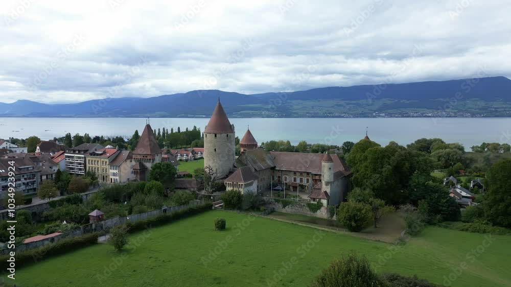 Dolly out drone shot of Chenaux Castle with Lake Neuchatel in Canton of Fribourg Switzerland Dolly out drone shot of Chenaux Castle with Lake Neuchatel in Canton of Fribourg Switzerland