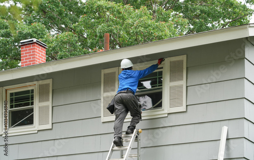 Bild auf Leinwand contractor working on replacing the window of the house