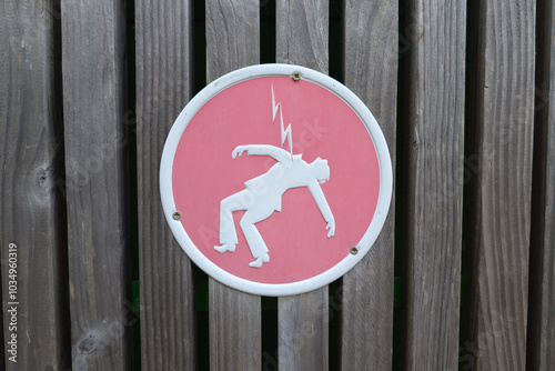 Danger of death red round high voltage sign photo