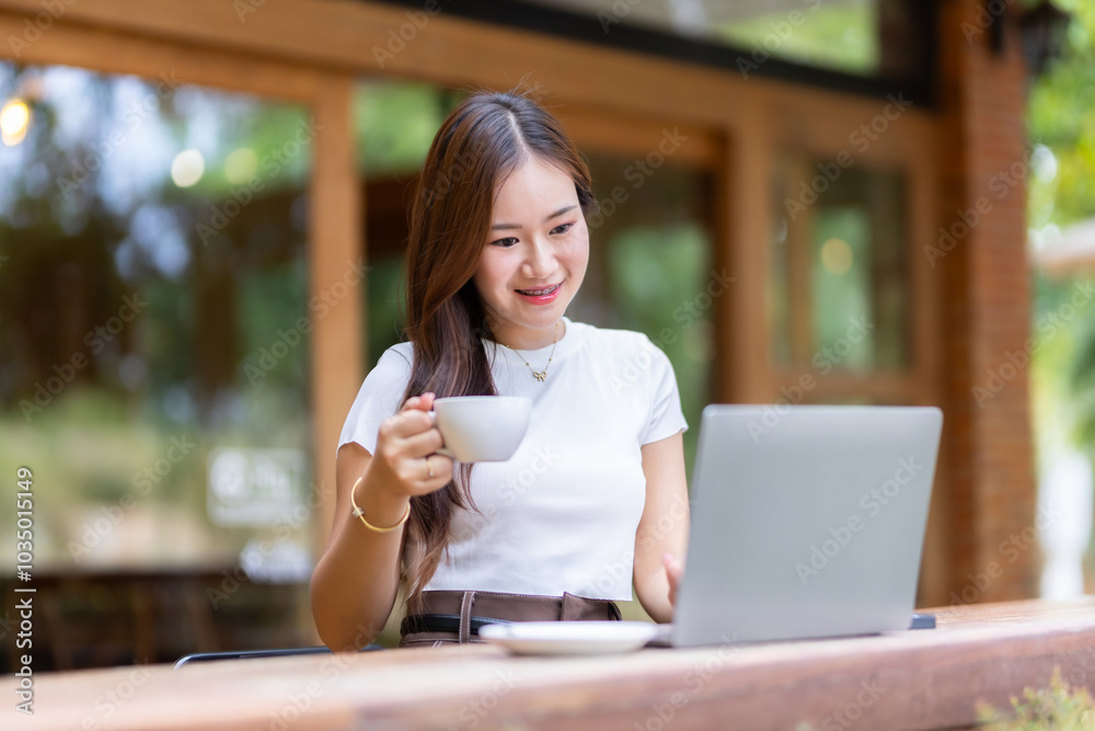 Happy of asian freelance people business female casual working with laptop computer and holding a coffee and smartphone in coffee shop like the background,communication concept