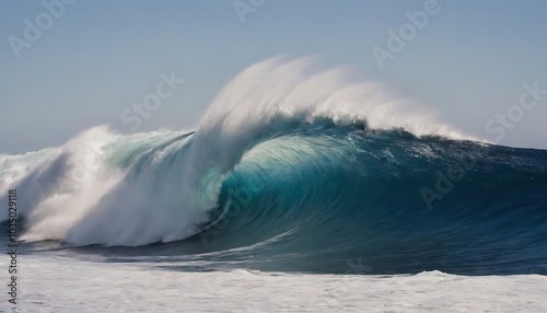 A massive, curling wave crashes against a deep blue ocean. The white foam and spray contrast beautifully with the deep blue water.