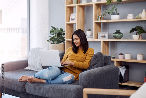 Home, laptop and woman with smile on sofa for website, registration and digital information on email. Happy, relax and female person with tech in living room for online shopping, network or ecommerce