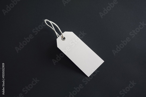 White clothing hang tag mockup blank paper cardboard price label tag with rope with sopy space photo