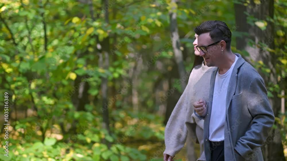 A tranquil moment captures a couple strolling through a lush, vibrant forest that beautifully showcases natures awe A tranquil moment captures a couple strolling through a lush, vibrant forest that beautifully showcases natures awe