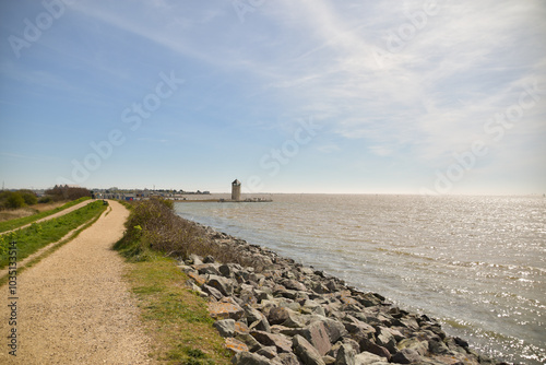 The sun shimmers on the estuary of the River Colne in Brightlingsea, Essex