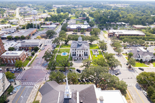 Aerial view of beautiful courthouse surrounded by greenery and historic buildings in downtown Thomasville, Georgia, United States.