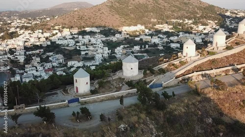 Greece,Leros Island, Panteli Village, Drone footage starting from famous windmills and over the Panteli village and the Aegean sea, beautiful white sailboats and yachts anchored all around the bay. photo