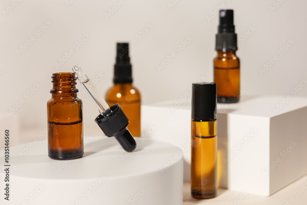 Amber cosmetic bottle on geometric pedestal podium, product packaging with natural shadows from plants