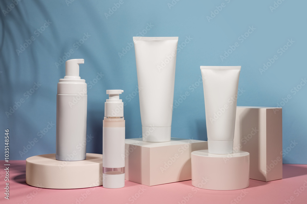 White cream tube on podium mockup on a blue background. The concept of cosmetology, body and face care