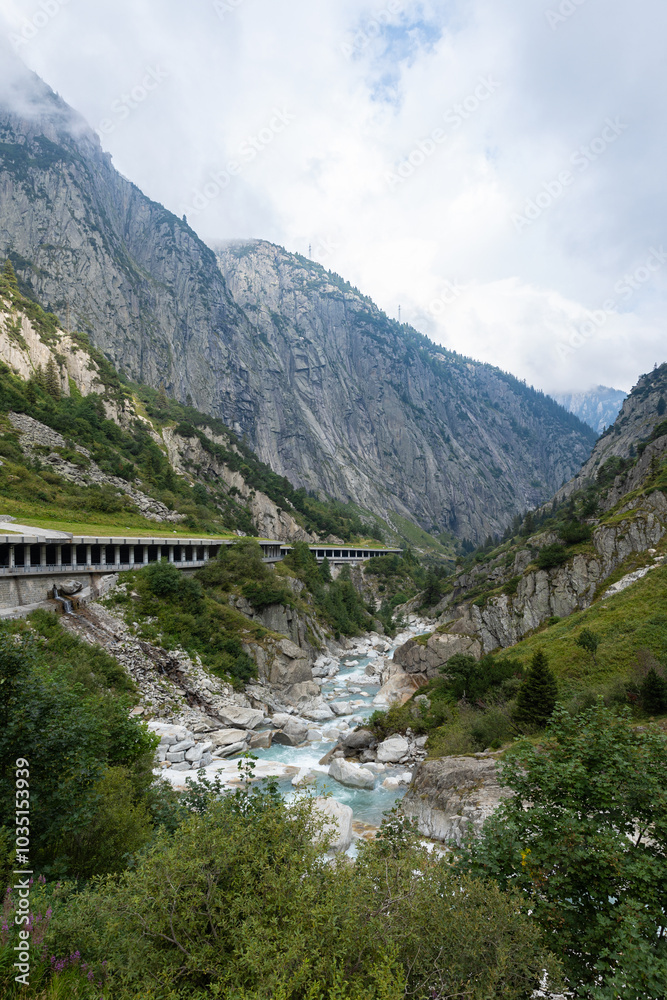 Swiss landscape with the Reuss River, road up the Gotthard Pass Swiss landscape with the Reuss River, road up the Gotthard Pass