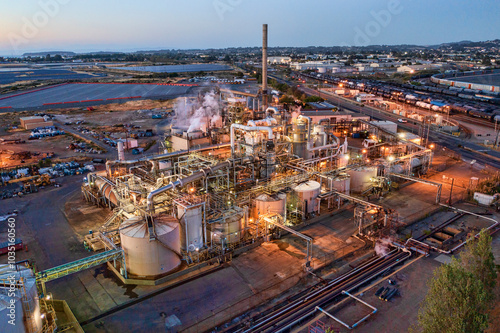 Aerial view of oil refinery with pipelines and chimneys in Richmond, California, United States.