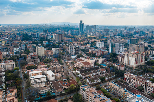 Aerial view of vibrant cityscape with modern high-rise buildings and bustling urban life, Westlands, Nairobi, Kenya. photo