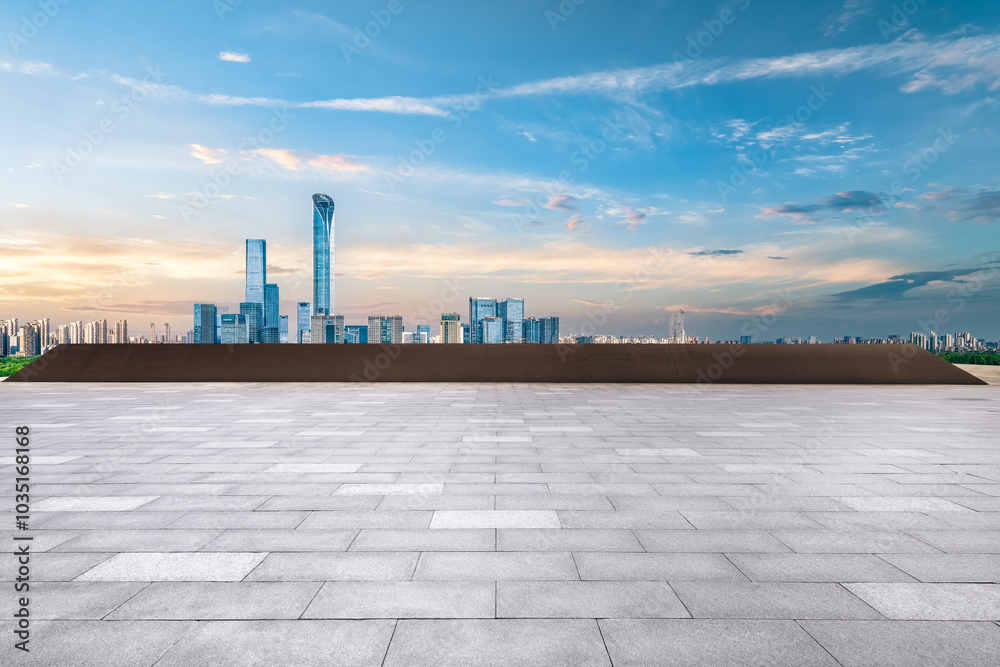 Empty floor square and cityscape with skyline in modern city at sunset Empty floor square and cityscape with skyline in modern city at sunset