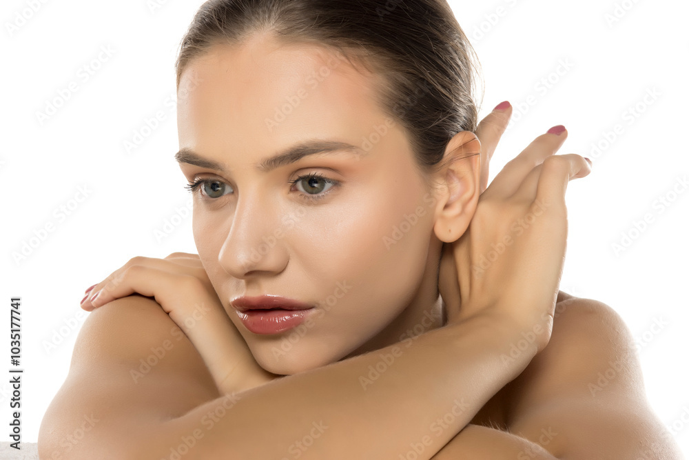 Beautiful young woman posing on the white. Skin, cosmetology Beautiful young woman posing on the white. Skin, cosmetology