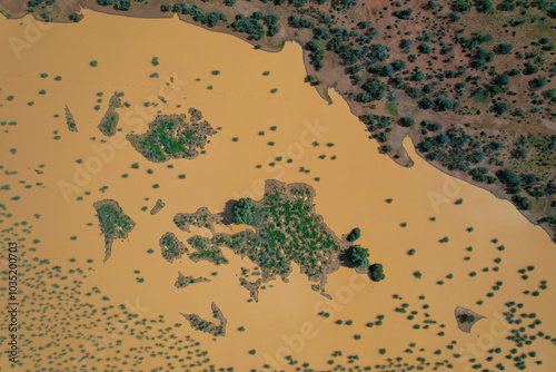 Aerial view of unique abstract patterns of sand and water surrounding Lake Breaden with beautiful natural vegetation, Gascoyne Region, Australia. photo