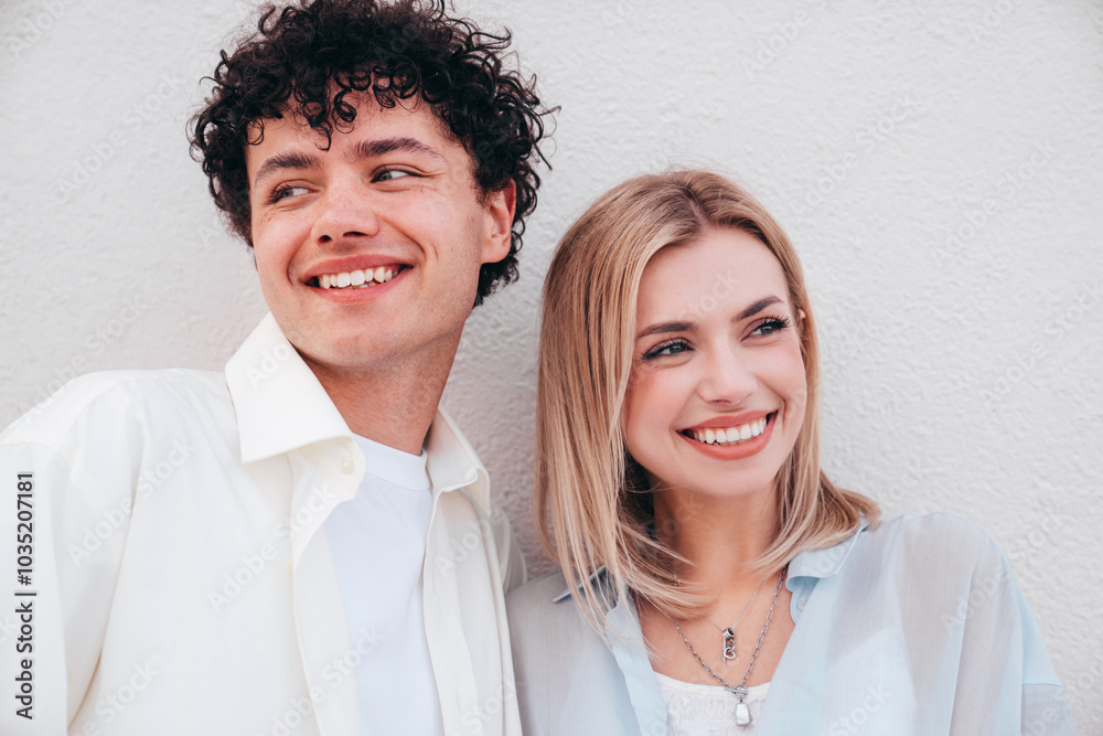 Smiling beautiful woman and her handsome boyfriend. Couple in casual summer clothes. Happy cheerful family. Female and man having fun. They posing in the street in sunny day. Having tender moments Smiling beautiful woman and her handsome boyfriend. Couple in casual summer clothes. Happy cheerful family. Female and man having fun. They posing in the street in sunny day. Having tender moments
