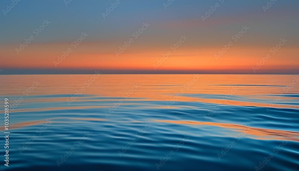 Calm Ocean at Twilight with Soft Orange and Blue Sky Reflections on the Water Calm Ocean at Twilight with Soft Orange and Blue Sky Reflections on the Water