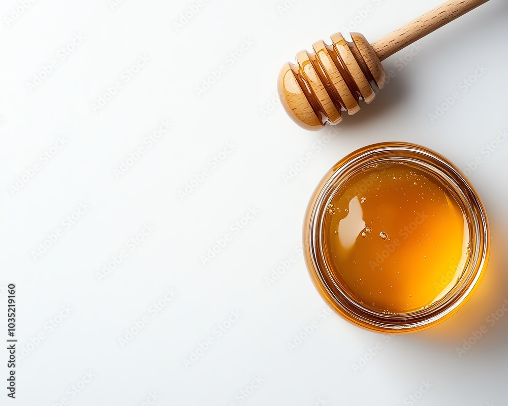 A top view composition of a honey jar and wooden dipper on a plain white background, featuring ample copy space for creative designs A top view composition of a honey jar and wooden dipper on a plain white background, featuring ample copy space for creative designs
