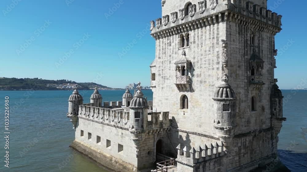 Low aerial orbits base of Belem Tower, medieval fort in Lisbon harbor Low aerial orbits base of Belem Tower, medieval fort in Lisbon harbor