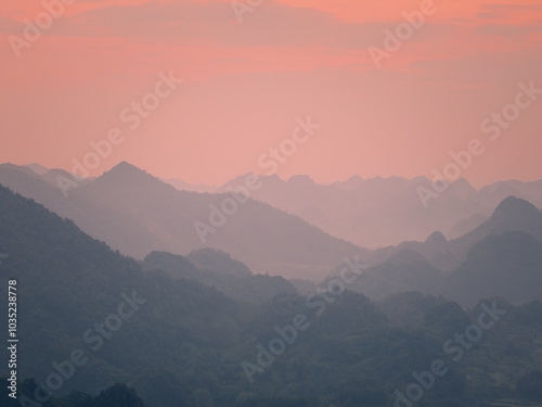 Orange sky and sea of clouds before sunrise. A peaceful, refreshing feeling. View of the hills surrounding Ba Quang, Ha Lang district, Cao Bang province, Vietnam