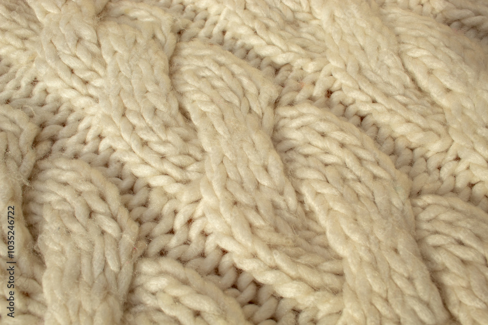Winter woolen knitting beige sweater clothing. Textile background Winter woolen knitting beige sweater clothing. Textile background