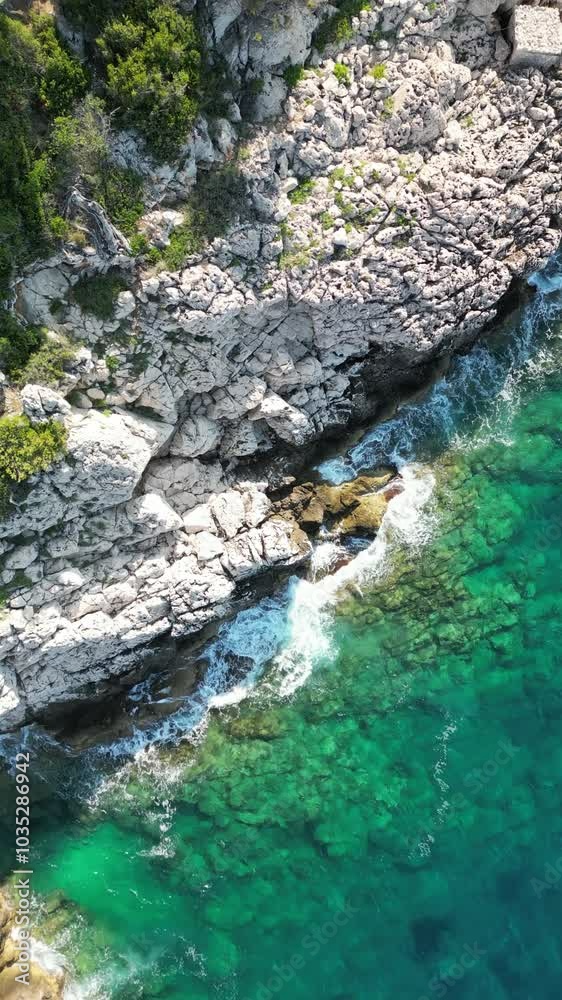 Aerial view of beautiful coastline with turquoise water and rugged cliffs, Roquebrune-Cap-Martin, France. Aerial view of beautiful coastline with turquoise water and rugged cliffs, Roquebrune-Cap-Martin, France.
