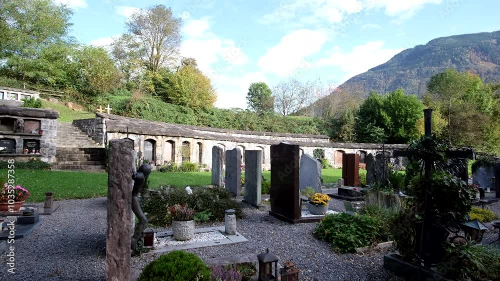 An array of beautiful sittings of tombstone or graveyard against an overcast sky. An array of beautiful sittings of tombstone or graveyard against an overcast sky.