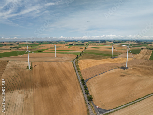 Aerial view of wind turbines amidst green fields and rural landscape, Son, Ardennes, France. photo