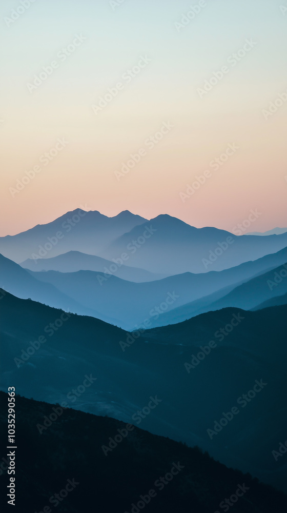 Mountain range silhouette with soft twilight colors Mountain range silhouette with soft twilight colors