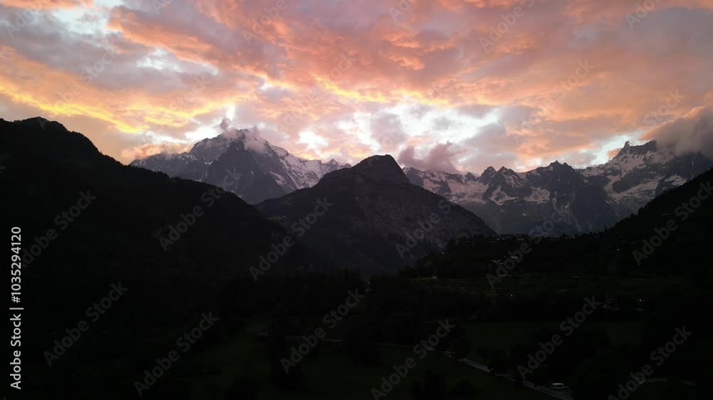 Aerial view of mont blanc at sunset with dramatic clouds and serene landscape, Palleusieux, Italy. Aerial view of mont blanc at sunset with dramatic clouds and serene landscape, Palleusieux, Italy.